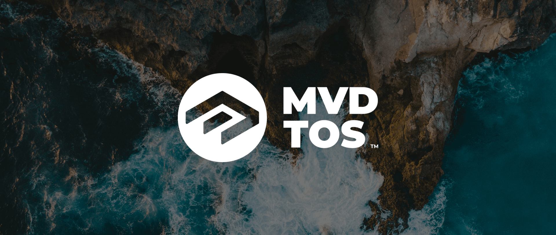 The MVD TOS logo over an aerial photo of waves breaking on rocks