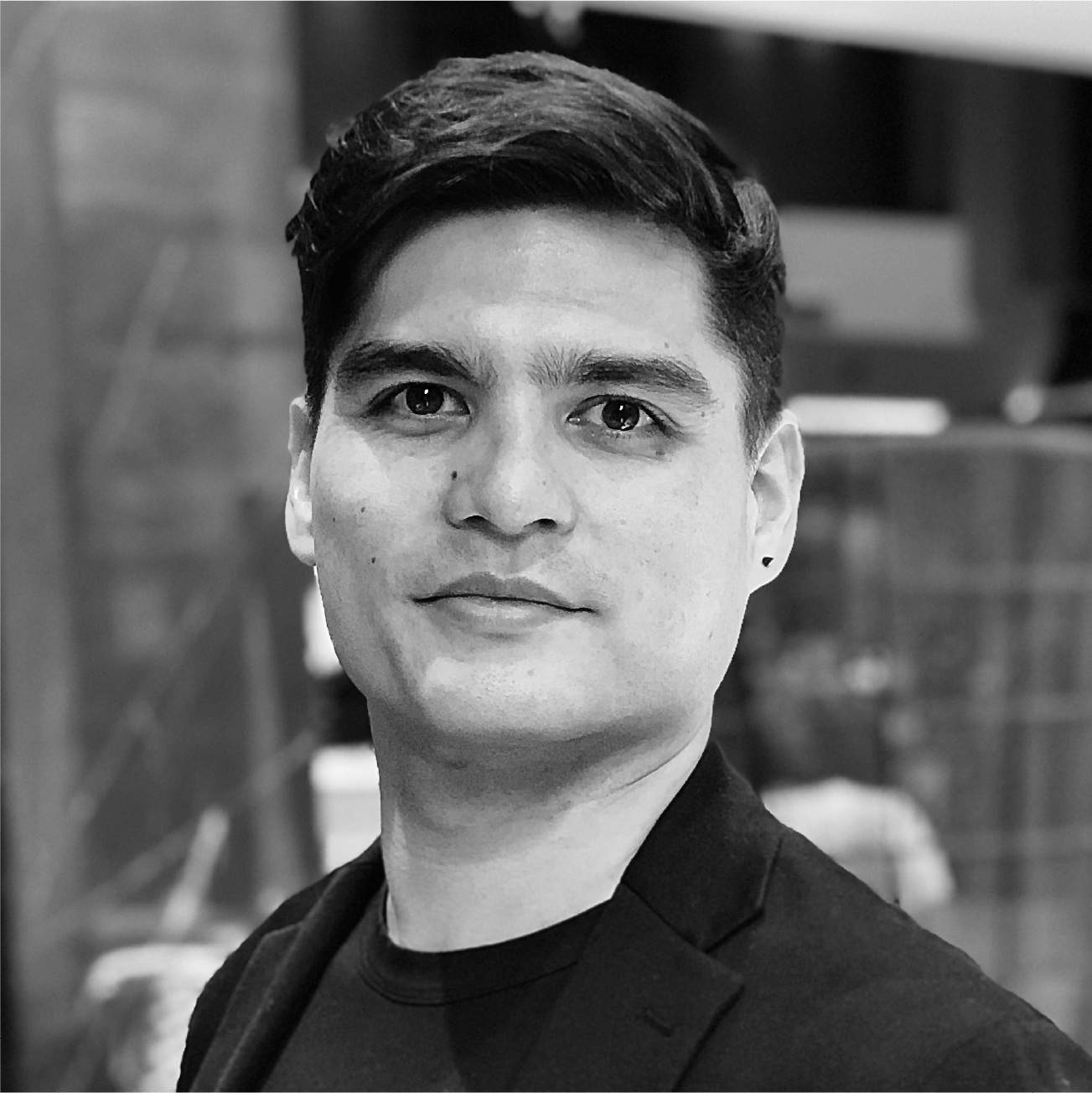 Black and white portrait of Matt Lok in a dark jacket