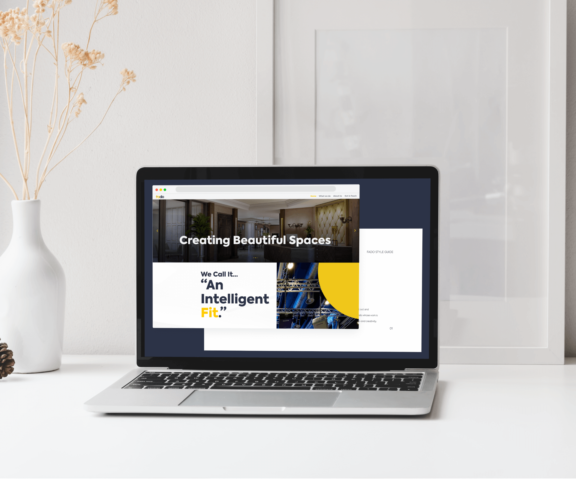 The new Fado website on a laptop on a white desk